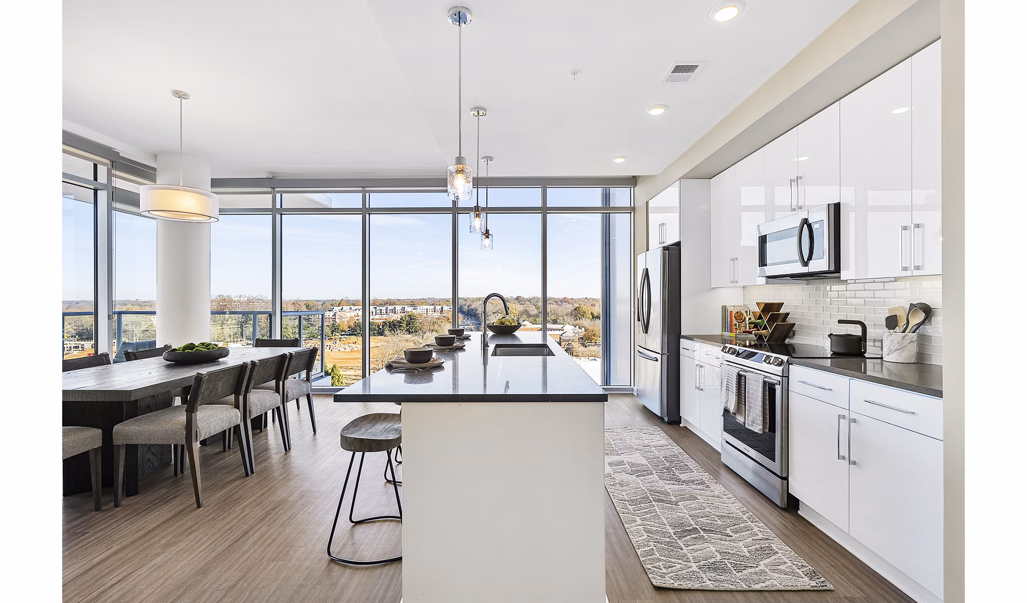 Contemporary kitchen with stainless steel appliances at Element SouthPark Apartments