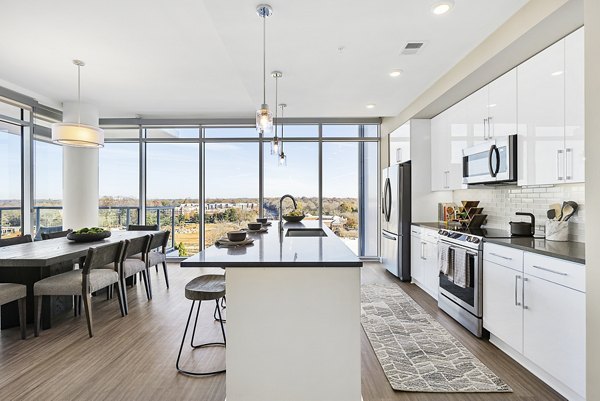 Contemporary kitchen with stainless steel appliances at Element SouthPark Apartments