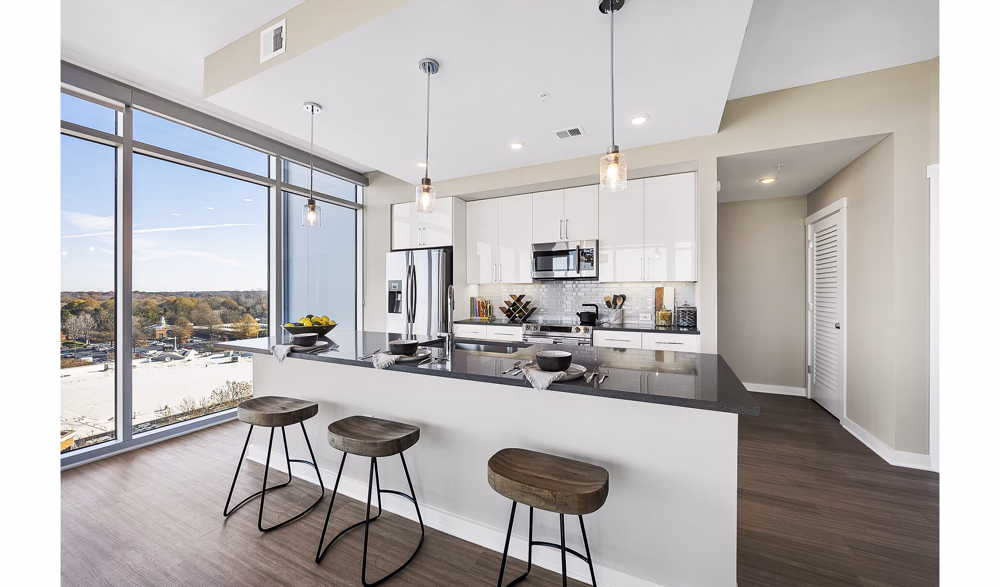 Modern kitchen with stainless steel appliances at Element SouthPark Apartments