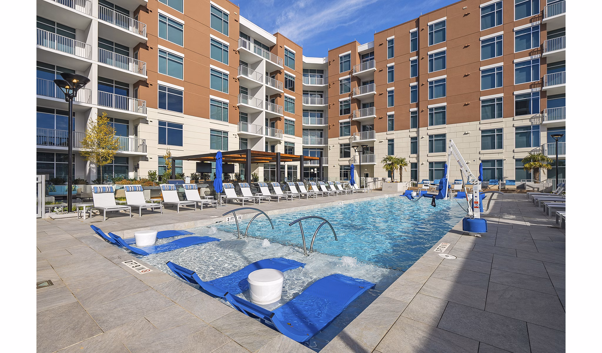 Relax by the sparkling outdoor pool at Element SouthPark Apartments, a vibrant community offering luxury living in an ideal location