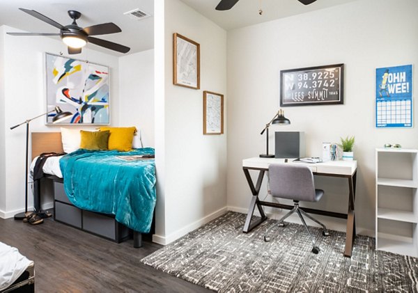Spacious living room with modern decor and natural light in HillTop Apartments