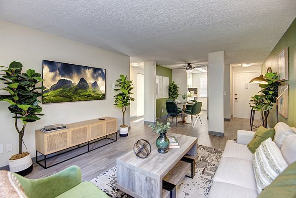Modern living room with stylish decor and large windows at Miro Apartments