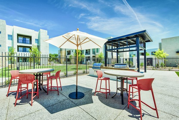 Chic outdoor patio space with modern seating at Amiya Apartments in vibrant neighborhood