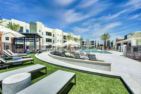 Rooftop pool offering city views at Amiya Apartments