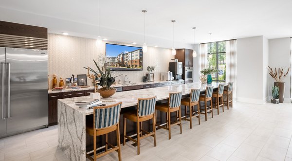 Clubhouse featuring modern design and cozy seating at Overture Cary Apartments