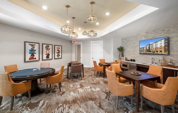 Clubhouse featuring modern design and open seating area at Overture Cary Apartments