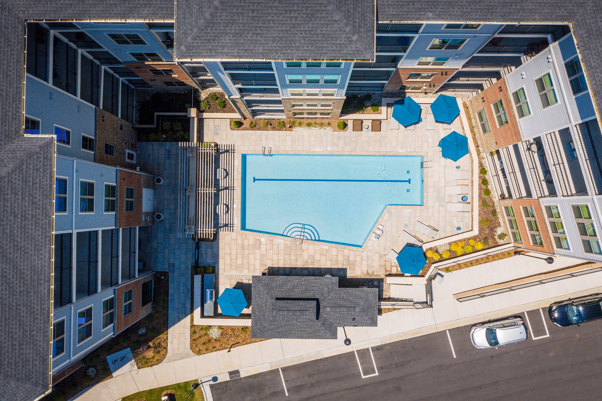 Rooftop pool with sun loungers at Overture Cary Apartments offering luxury leisure for residents