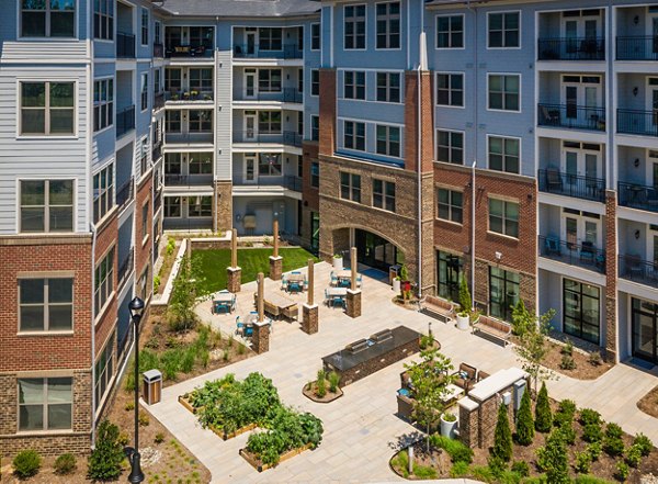 Tranquil courtyard with lush gardens at Overture Cary Apartments