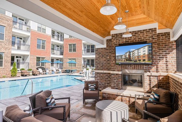 Elegant outdoor patio with comfortable seating at Overture Cary Apartments, offering serene relaxation space