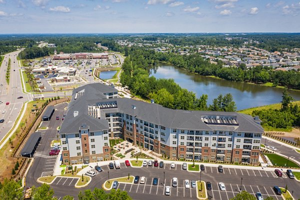 Overture Cary: Modern view of luxury apartments with lush landscaping in Cary, ideal for active retirees seeking premium living