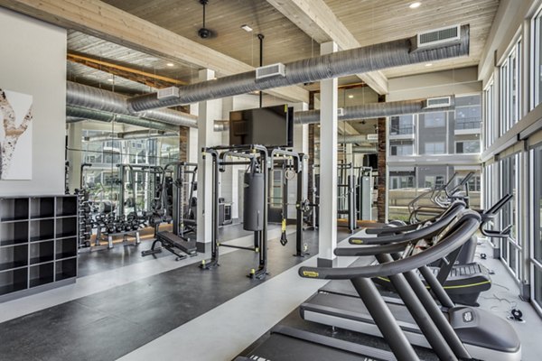 Modern fitness center with state-of-the-art equipment at Trailhead Apartments for an active lifestyle