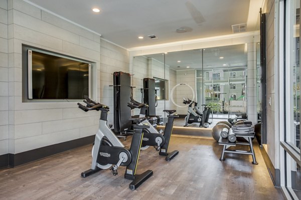 State-of-the-art fitness center with modern equipment at Trailhead Apartments, offering a perfect workout space for residents