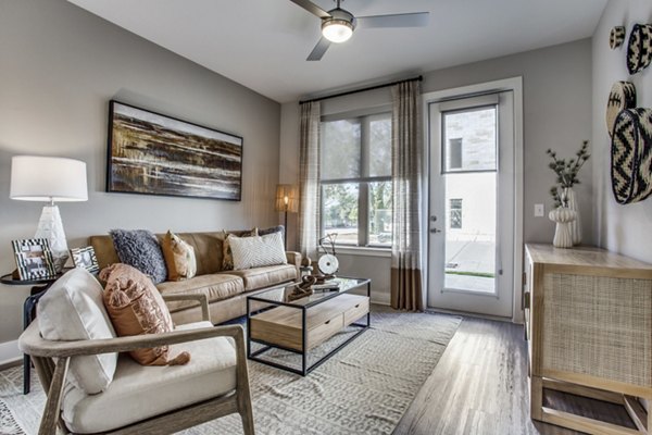 Modern living room with stylish decor and natural light at Trailhead Apartments, offering luxury Greystar community living