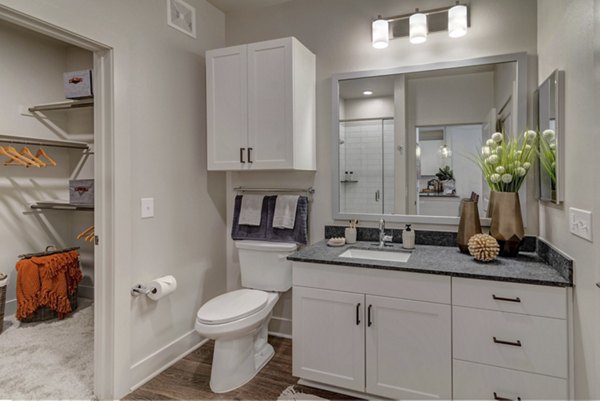 Bathroom with modern fixtures at Album Keller Ranch Apartments featuring sleek cabinetry and elegant tilework