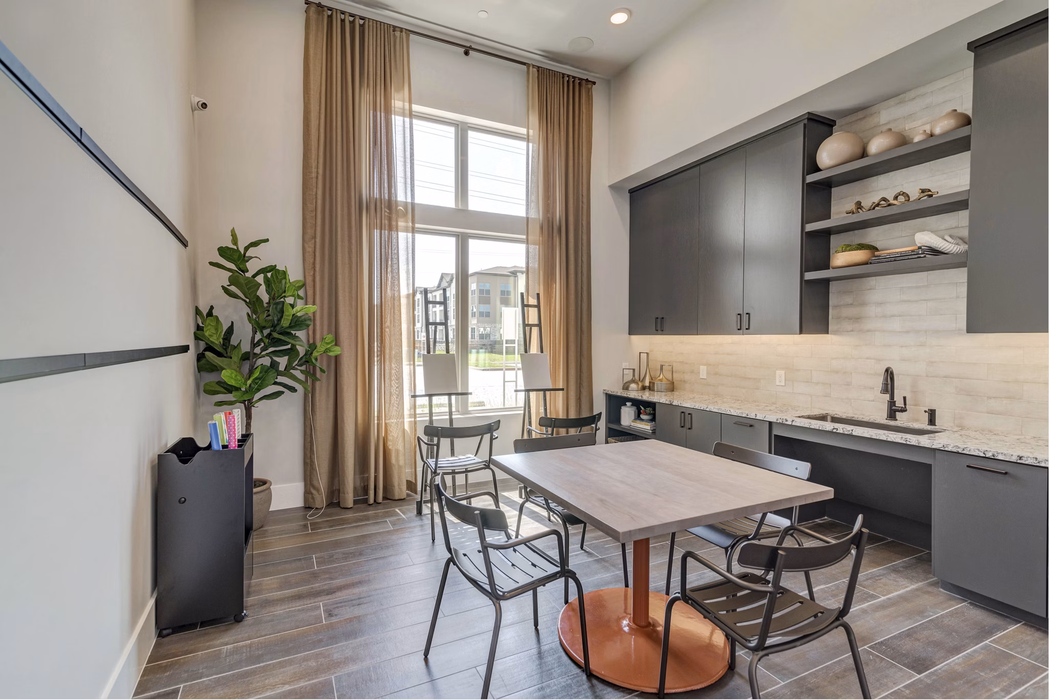 Clubhouse kitchen area featuring modern appliances and island seating at Album Keller Ranch Apartments Perfect for luxury entertaining and gatherings