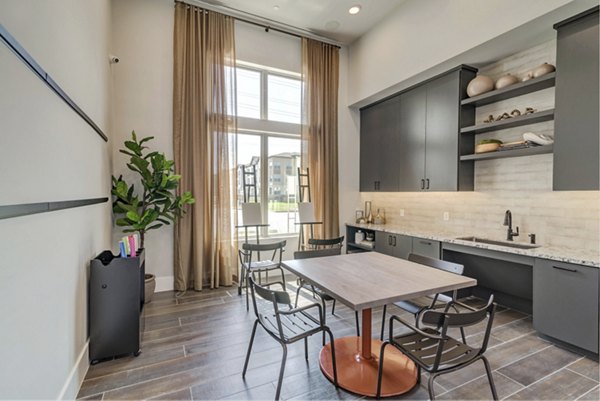 Clubhouse kitchen area featuring modern appliances and island seating at Album Keller Ranch Apartments Perfect for luxury entertaining and gatherings