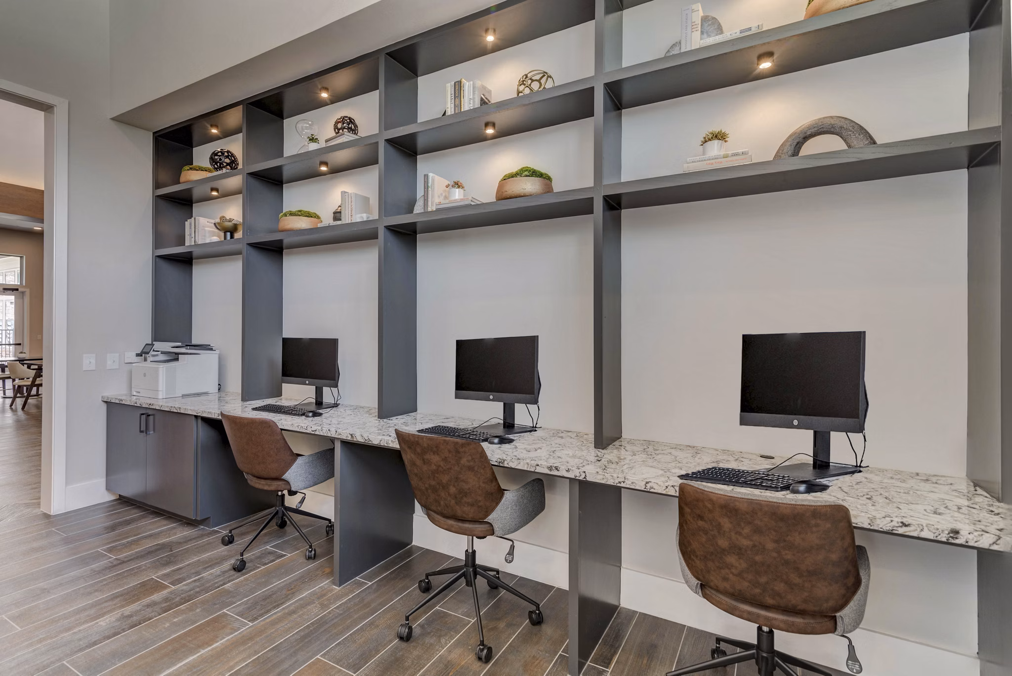 Modern business center with sleek workstations at Album Keller Ranch Apartments, perfect for productivity and collaboration