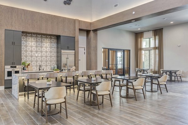 Stylish clubhouse dining area with modern decor at Album Keller Ranch Apartments