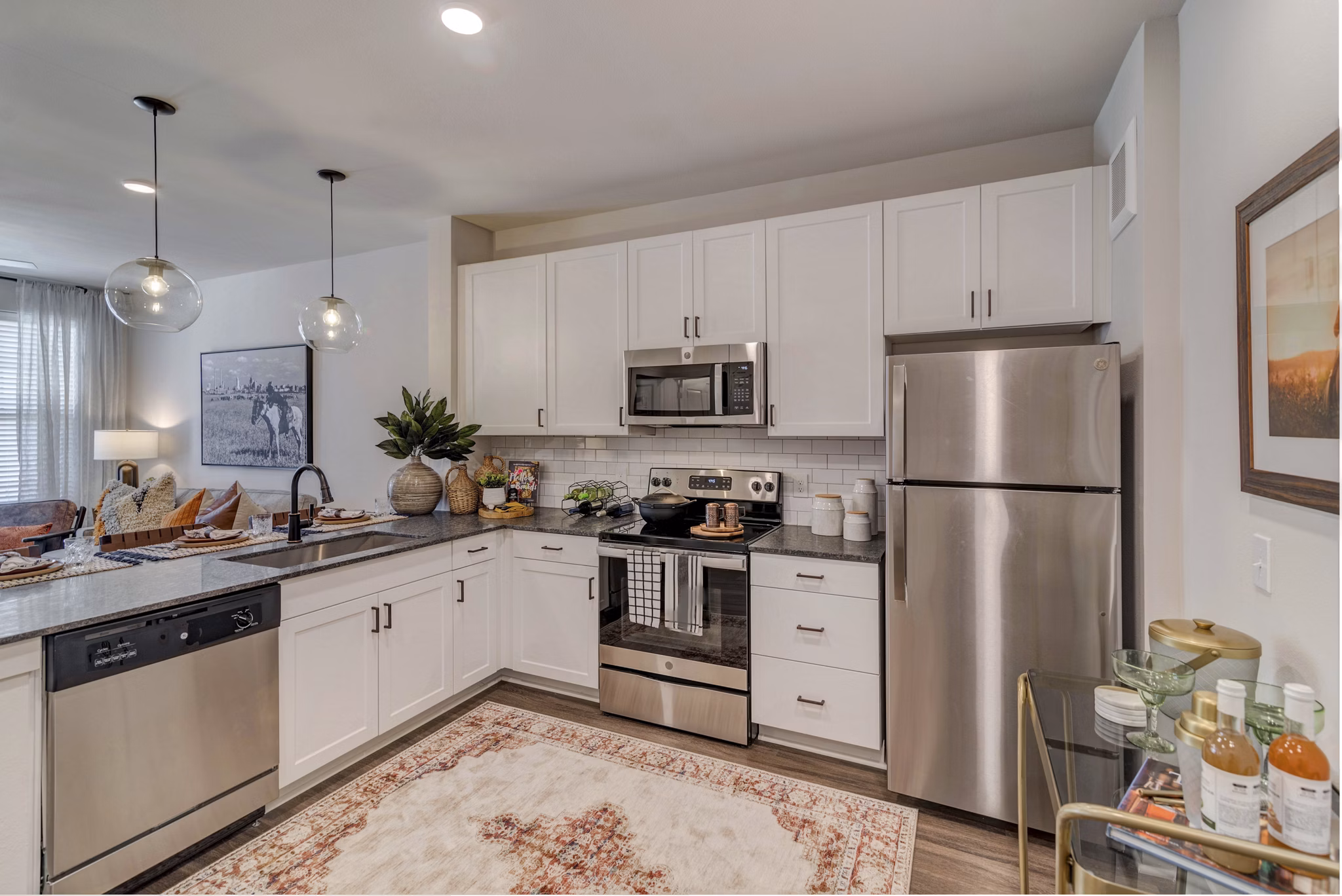 Modern kitchen with stainless steel appliances in Album Keller Ranch Apartments