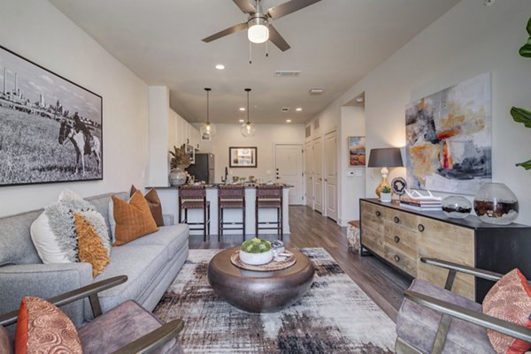 Living room with modern decor at Album Keller Ranch Apartments, featuring cozy seating and abundant natural light