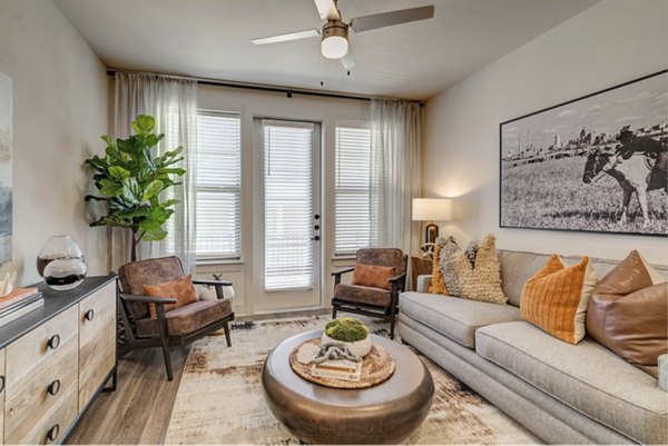 Spacious living room featuring modern decor and natural light in Album Keller Ranch Apartments