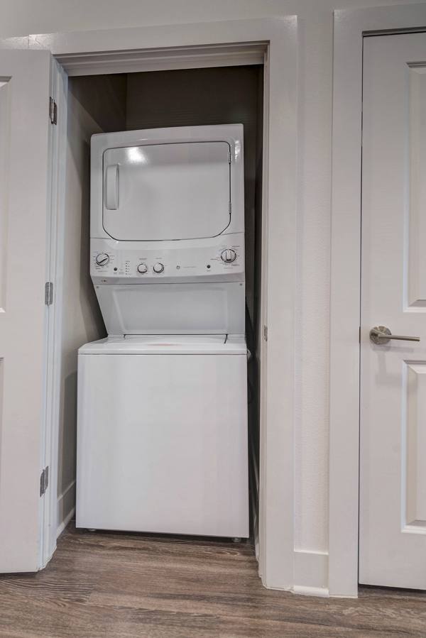 laundry room with stackable washer and dryer at Album Keller Ranch Apartments