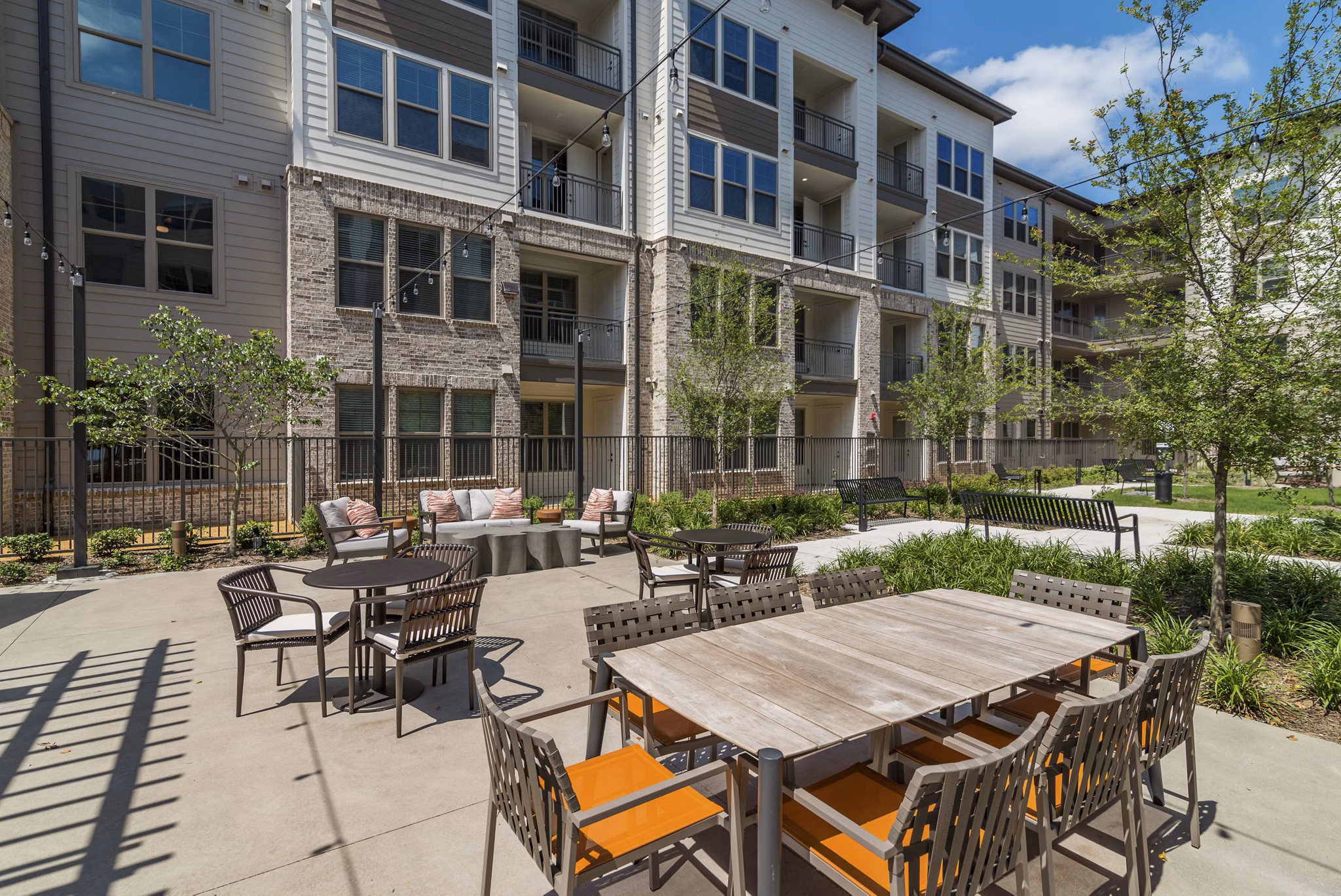 Outdoor grill area with modern BBQ facilities at Album Keller Ranch Apartments