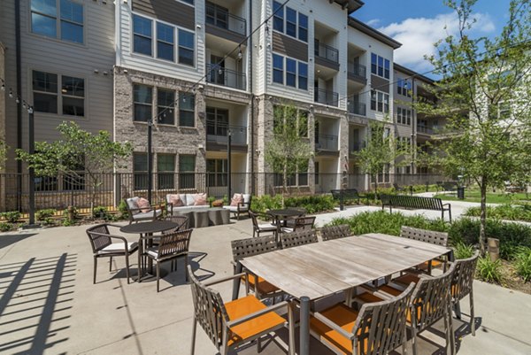 Outdoor grill area with modern BBQ facilities at Album Keller Ranch Apartments