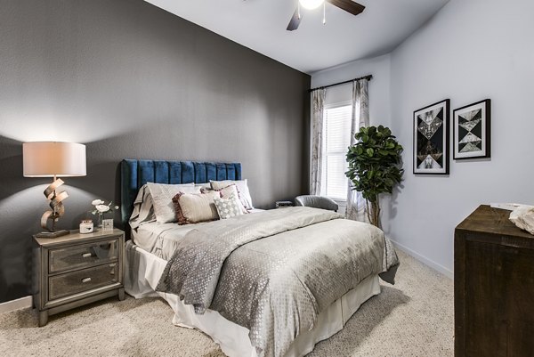 Cozy bedroom with modern decor at Mezzo Kirby Med Center Apartments