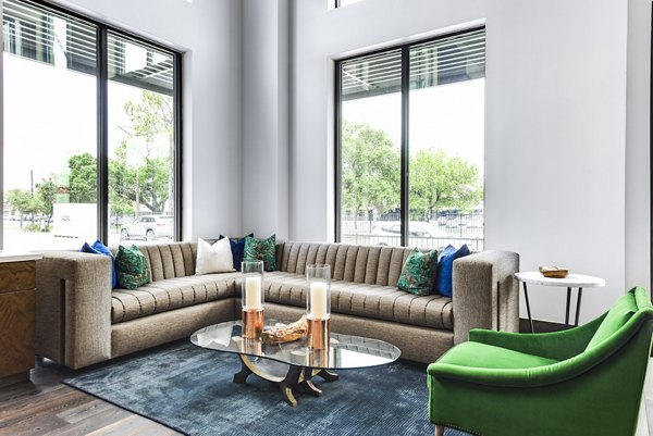 Clubhouse lounge with modern seating and decor at Mezzo Kirby Med Center Apartments