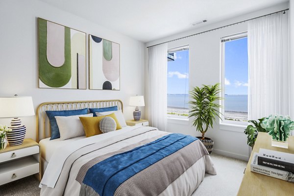 Cozy bedroom with modern furnishings at Ryder Apartments, offering luxury living spaces in a prime location