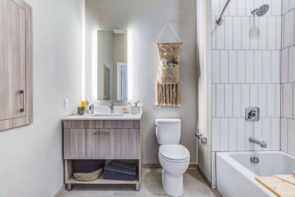 Modern bathroom with sleek fixtures and neutral tones at Ryder Apartments