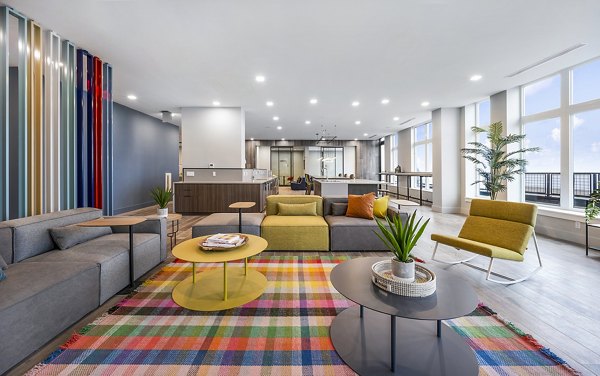 Clubhouse lounge featuring modern furnishings and communal spaces in Ryder Apartments