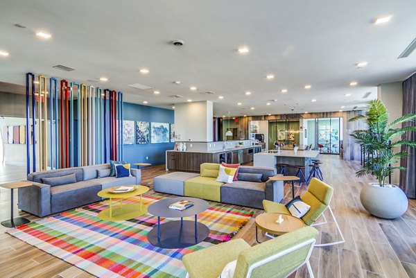 Elegant clubhouse with modern dÃ©cor at Ryder Apartments, featuring plush seating and a sleek interior design for luxury living experiences