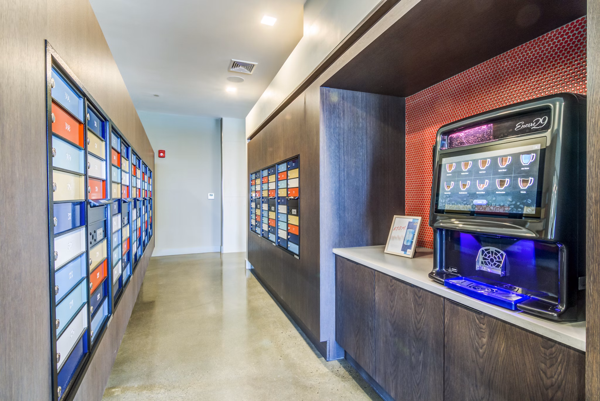 Modern clubhouse mail room at Ryder Apartments featuring secure mailboxes and package lockers