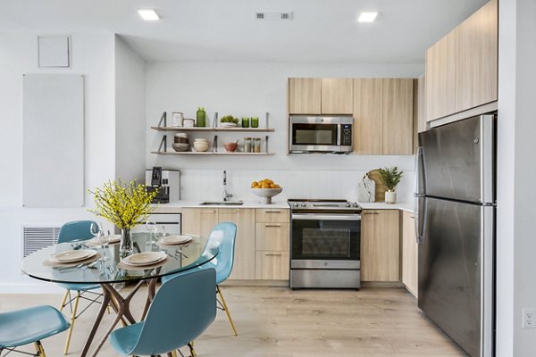 Dining room featuring modern decor and sleek dining set at Ryder Apartments