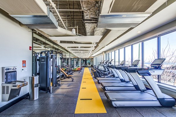 Fitness center equipped with modern workout machines at Ryder Apartments