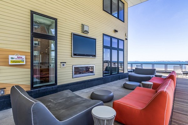 Cozy patio with stylish seating at Ryder Apartments, perfect for relaxing and enjoying the view