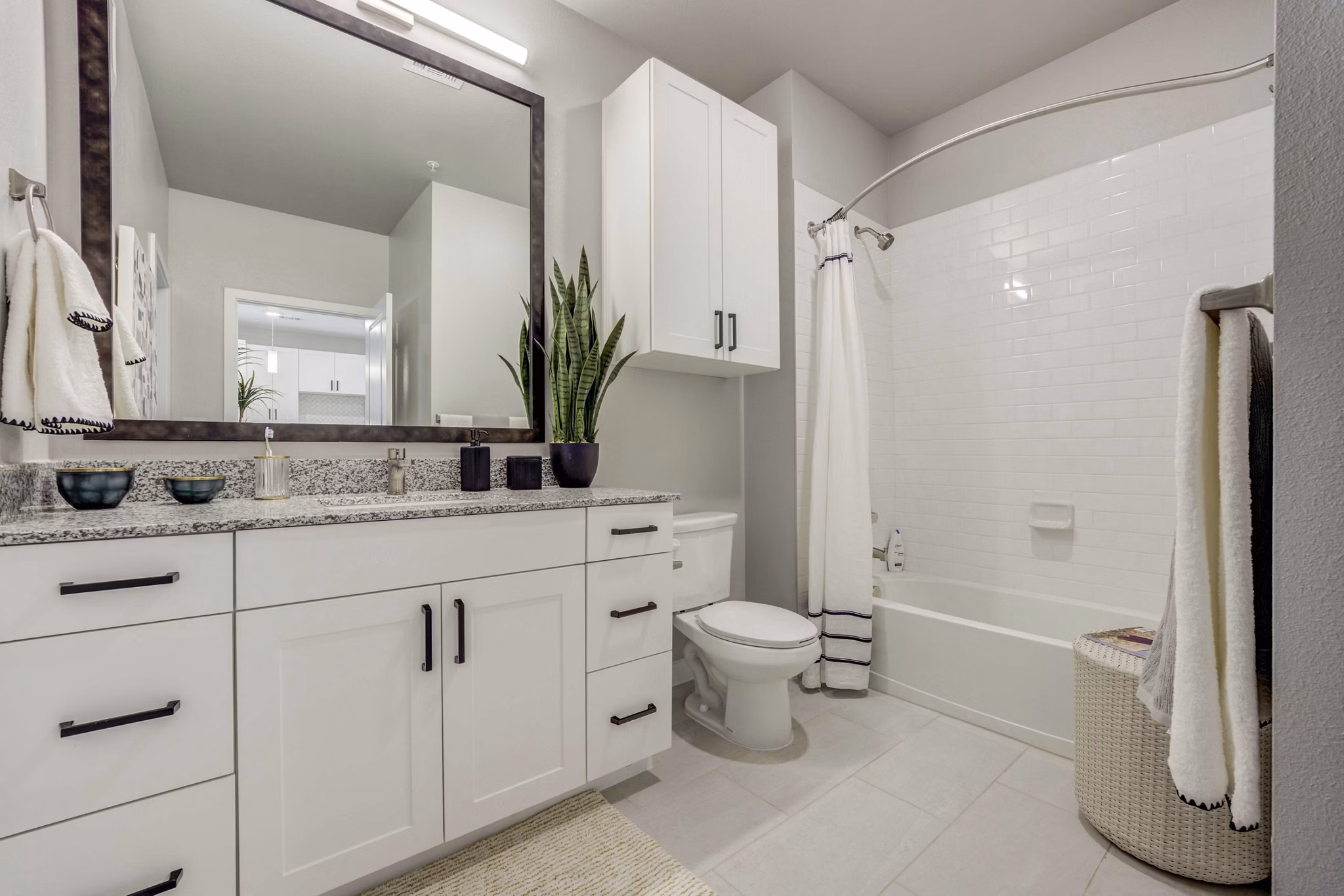 Modern bathroom with sleek fixtures at Alder Apartments featuring luxurious amenities