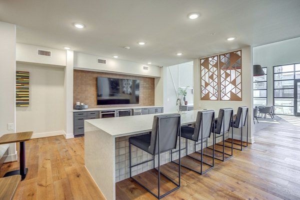 Modern clubhouse featuring lounge and workspaces at Alder Apartments