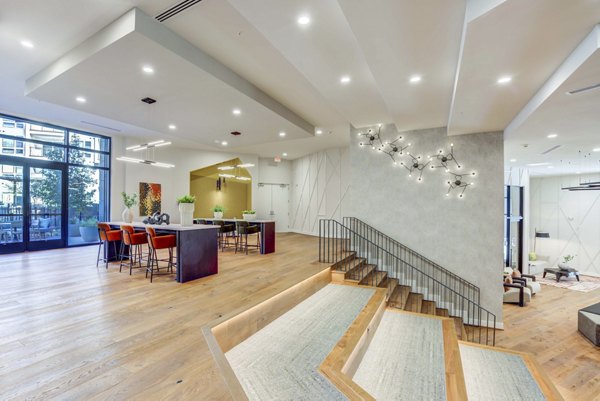 Clubhouse at Alder Apartments: Modern space with seating areas and game tables