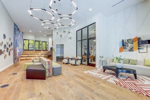 Modern clubhouse with stylish seating and pool table at Alder Apartments luxury community