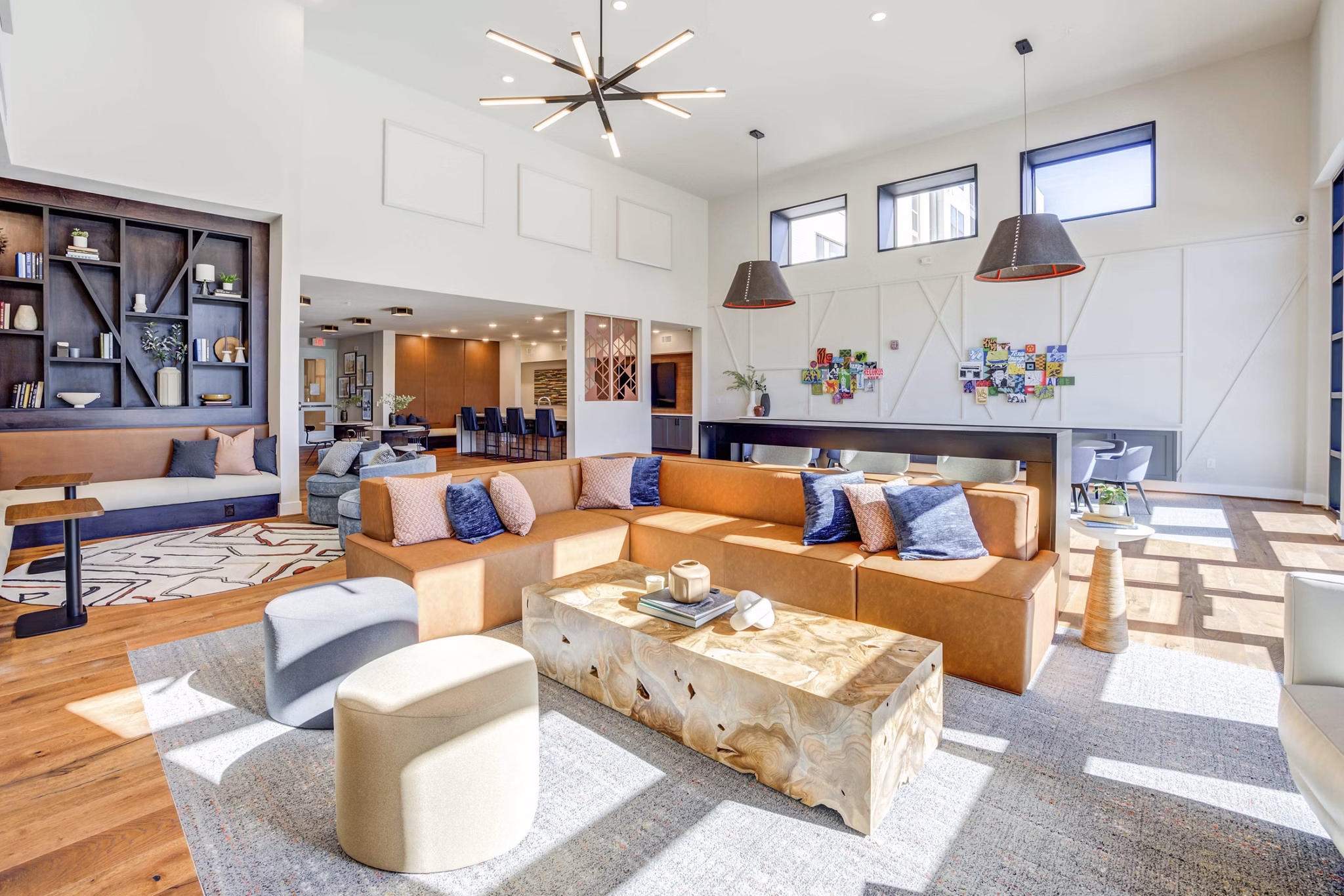 Alder Apartments: Elegant clubhouse featuring modern seating and entertainment areas in luxury community