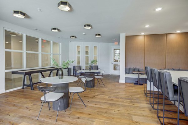 Modern clubhouse with stylish seating and billiards at Alder Apartments