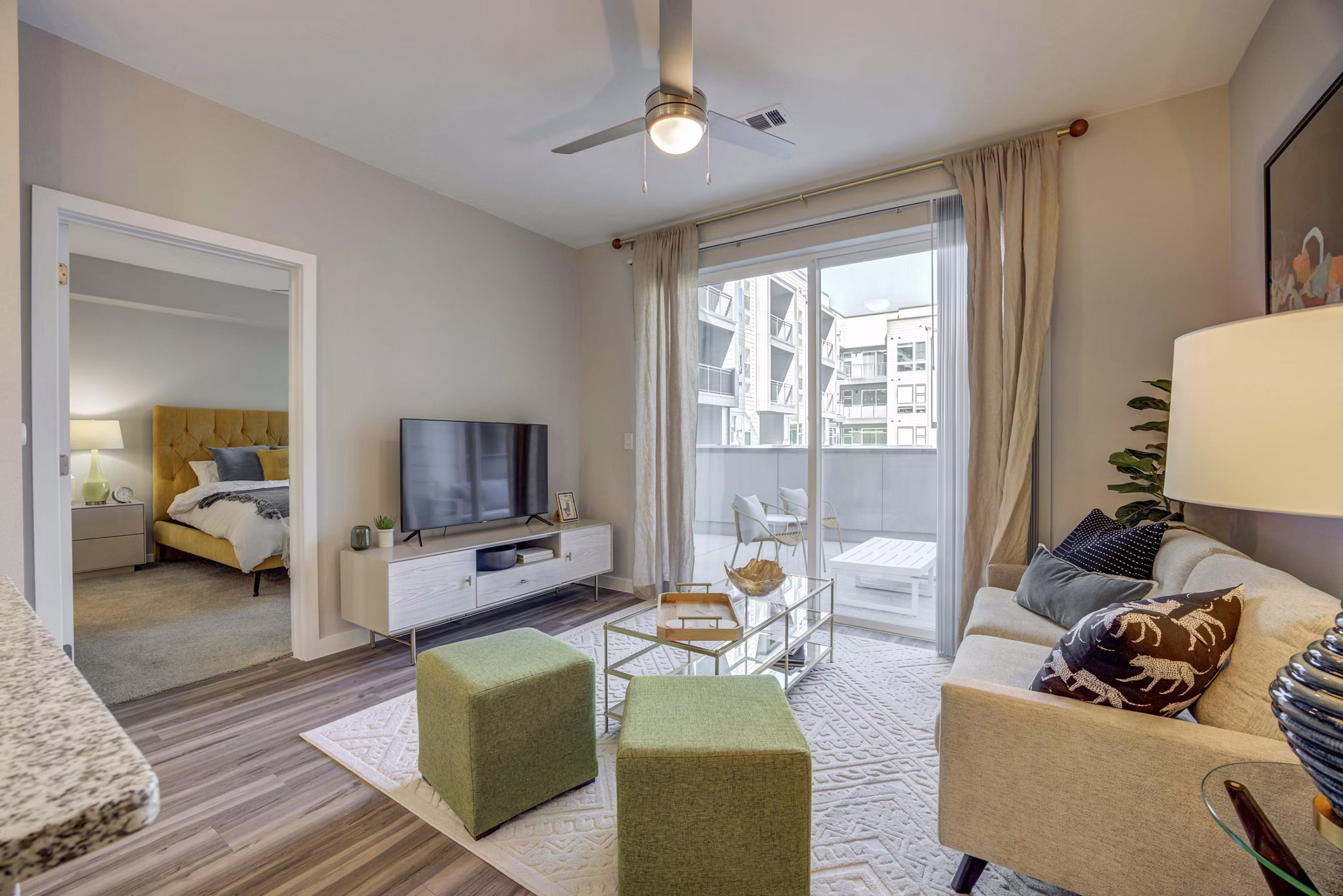 Spacious living room with modern decor and natural light in Alder Apartments luxury residences