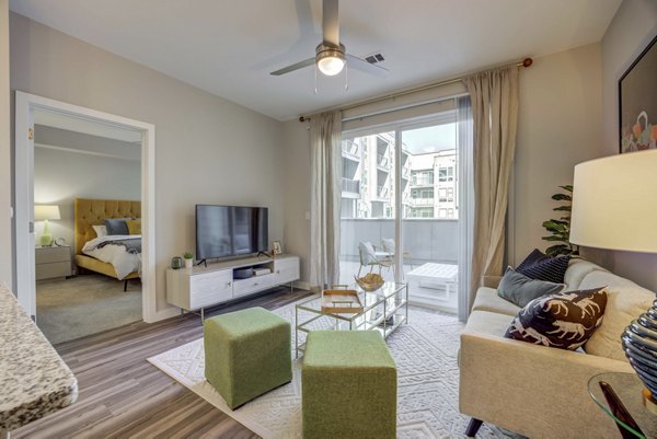 Spacious living room with modern decor and natural light in Alder Apartments luxury residences