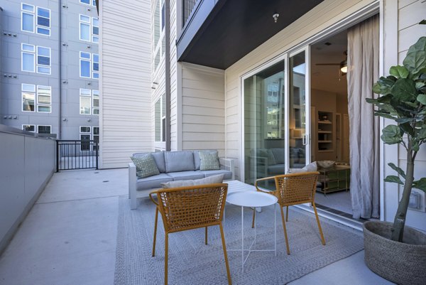 Modern patio with stylish furniture at Alder Apartments, a Greystar luxury apartment community