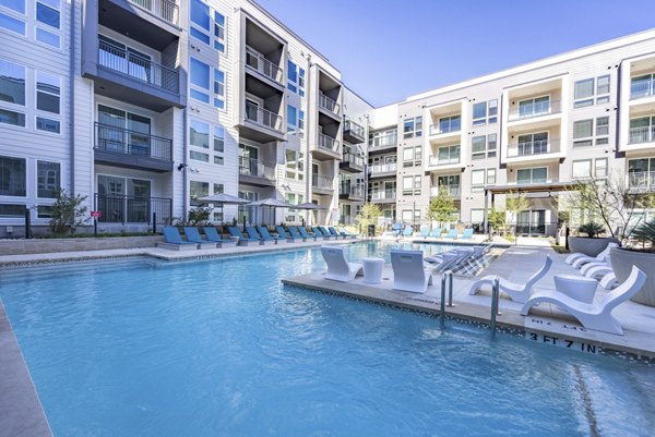 Inviting outdoor pool at Alder Apartments, a luxury community by Greystar, perfect for relaxation and leisure activities