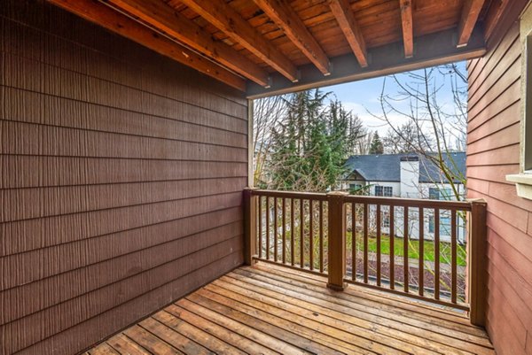 Charming patio space with outdoor seating at Willamette Gardens Apartments, ideal for relaxation and entertaining guests