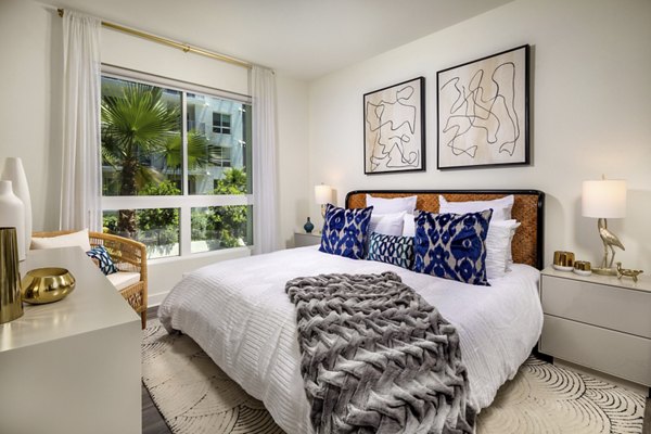 Elegant bedroom with modern decor at Rise Hollywood Apartments
